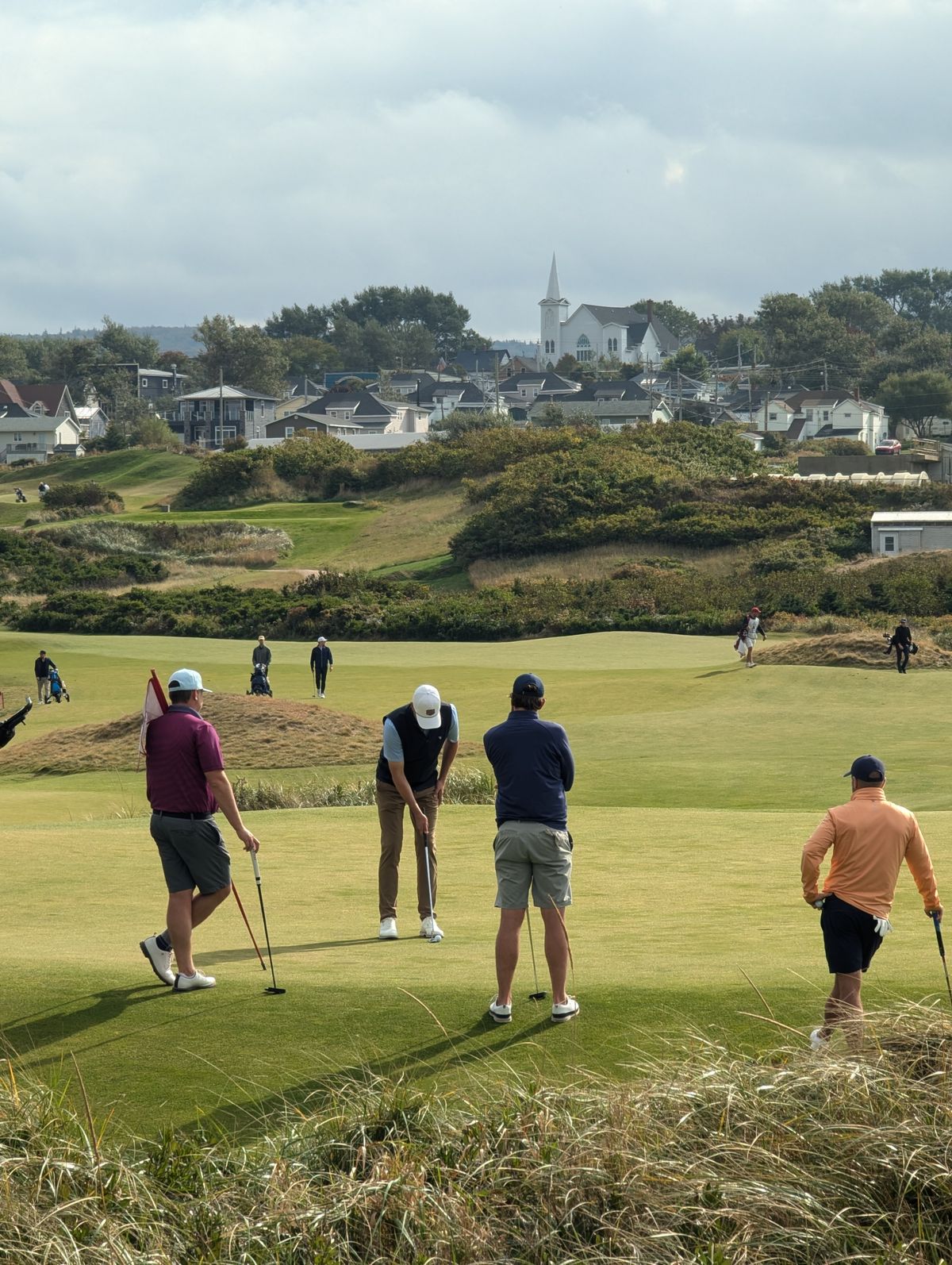 Golfers gathered together on the green